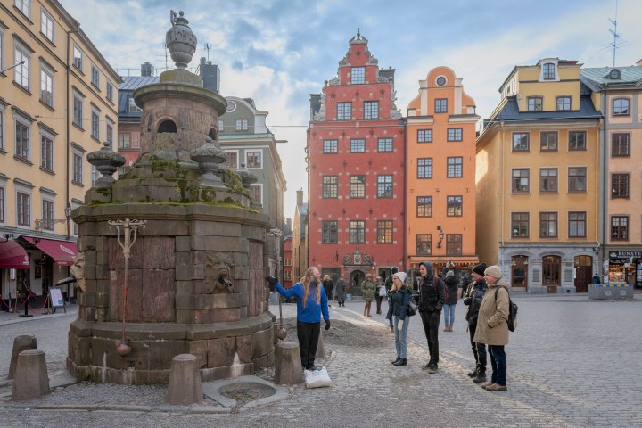 a group of people standing in front of a building